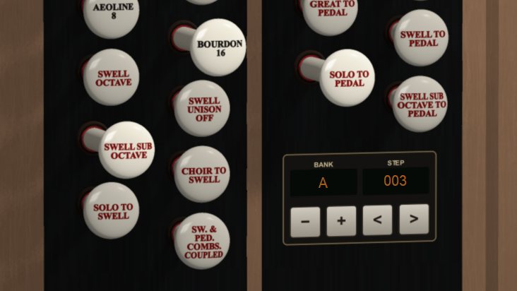 Close-up of drawstops beside a combination bank and step display